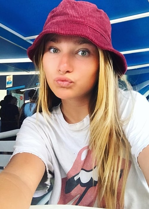 Ava August as seen pouting while taking a selfie wearing a hat in Oranjestad, Aruba in April 2019