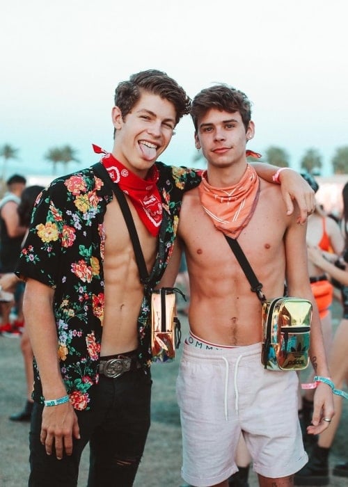 Caleb Burton as seen while sporting a shirtless look alongside famous YouTuber and social media star, Ben Azelart, in Coachella, California, United States in April 2019