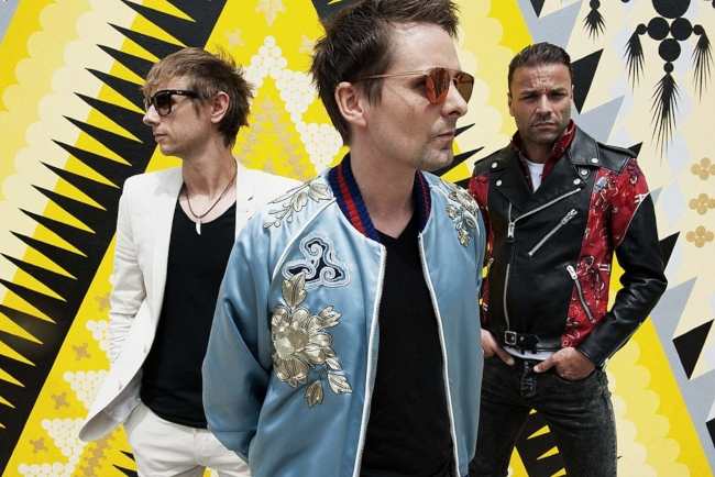 Chris with other members from Muse Matt Bellamy and Dominic Howard appearing in the band's official photo in April 2017