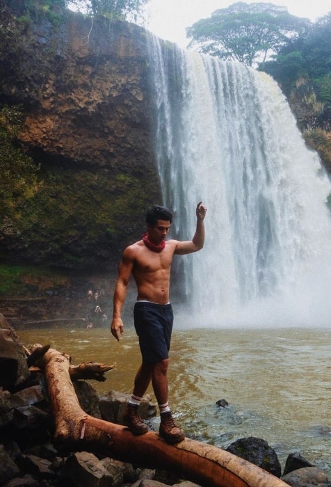 Drew Ray Tanner pictured shirtless before he did a triple back flip sailor dive into the water at the Wailua Falls in Hawaii in January 2019