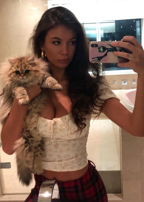 Erin Willerton as seen while taking a mirror selfie with Chewie the cat in London, England, United Kingdom in December 2018