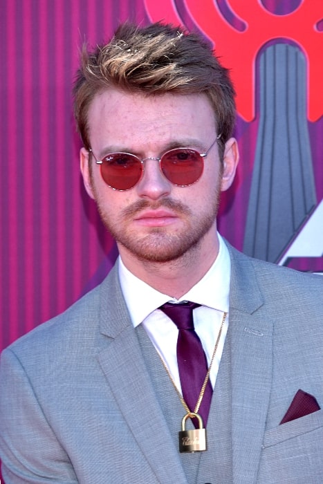 Finneas O'Connell as seen while posing for the camera at the 2019 iHeartRadio Music Awards in Los Angeles, California, United States