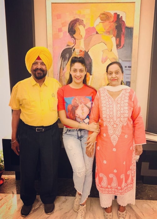 Gurleen Chopra as seen in a picture with her father Harjit Singh Chopra (On The Left) and mother Anup Chopra (On The Right) at James Hotel, Chandigarh in June 2019