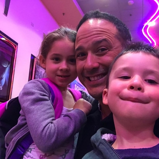 Joe Nieves as seen in a picture with his kids while watching a movie in May 2019