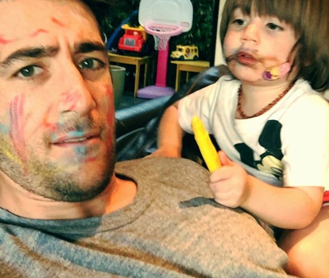 Jonathan Togo with his son as seen in March 2015