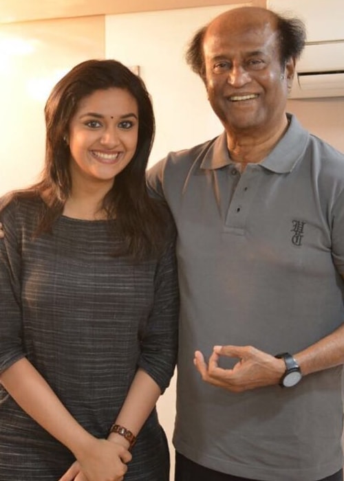 Keerthy Suresh as seen in a picture with legendary actor Rajinikanth in December 2018