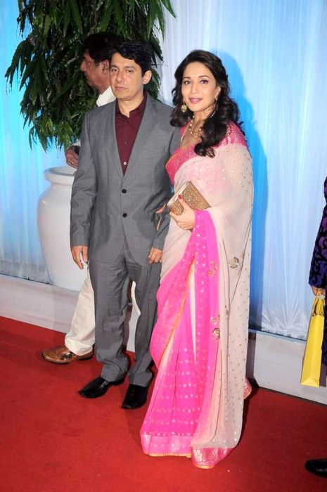 Madhuri Dixit seen with husband Dr Shriram Nene at the wedding reception of Esha Deol in 2012