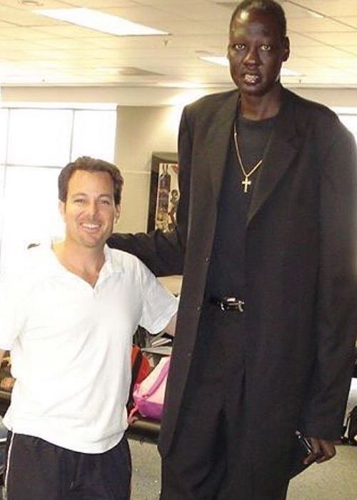 Manute Bol (Right) with comedian Dave Burleigh