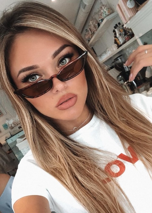 Natalie Danish as seen while taking a selfie wearing cat-eye sunglasses in June 2018