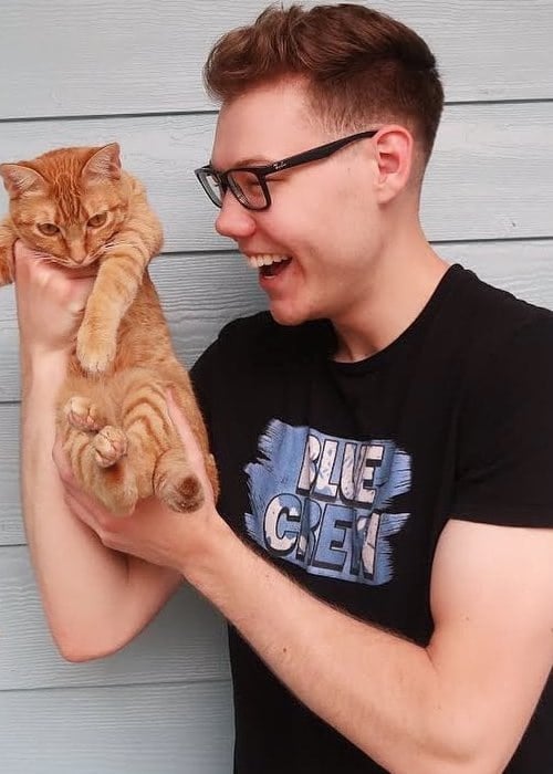 SeeDeng with his cat as seen in April 2019