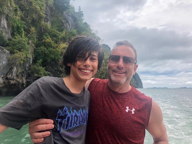 Alec Golinger as seen while posing for a picture with his father in December 2018