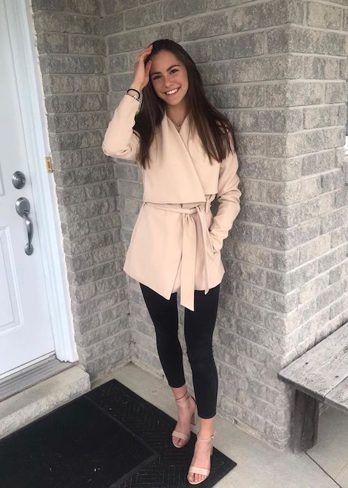 Alex Hook wearing Revel Beige Coat in an Instagram picture in June 2019