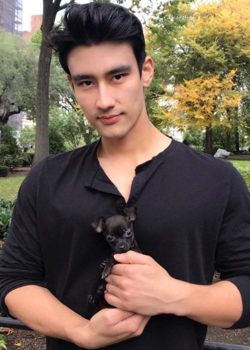 Alex Landi with his dog as seen in October 2018