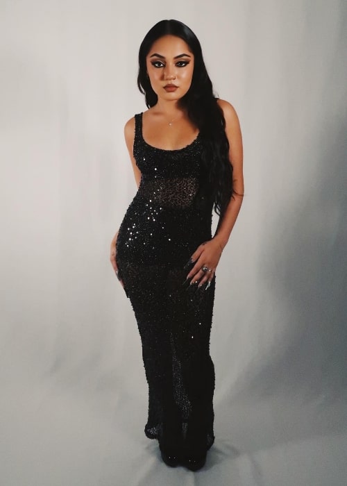 Avani Gregg wearing a black dress for a photoshoot in July 2023