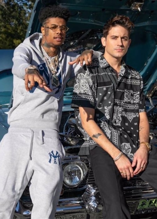 Blueface (Left) as seen while posing for a picture with rapper G-Eazy in February 2019