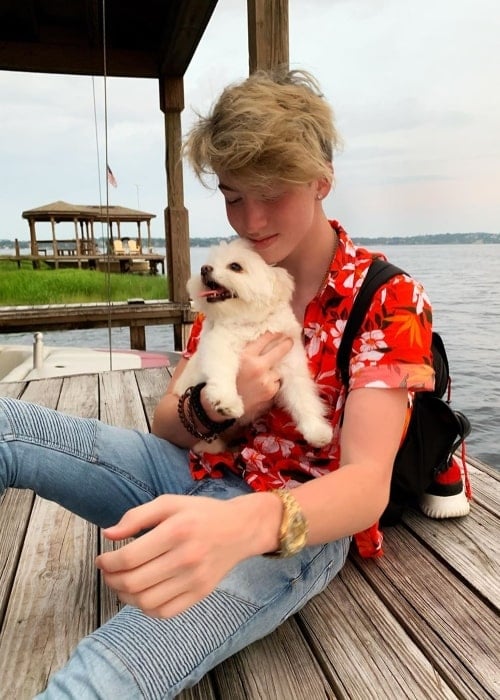 Cash Baker as seen while posing for a picture with a puppy in June 2019