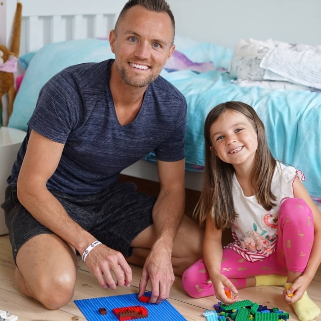 Darren Fizz as seen while posing for the camera with his daughter as they both spend some LEGO-time in November 2018