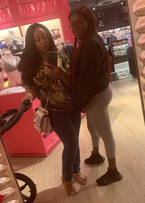Dee Dee Davis as seen while taking a mirror selfie with Alaina Simone during their visit to a mall in April 2019