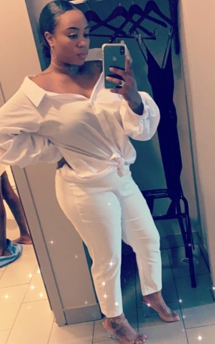 Dee Dee Davis as seen while taking an all-white mirror selfie in September 2018