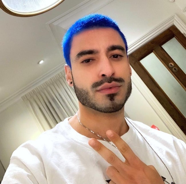 Jade Hassouné as seen while taking a selfie sporting his blue hair in Montreal, Quebec, Canada in April 2019