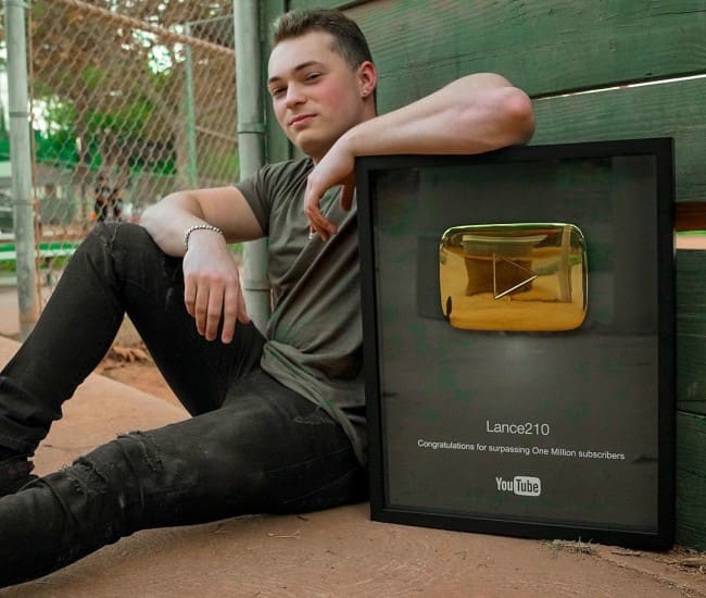 Lance Stewart in an Instagram post with his Golden YouTube Play Button in October 2017