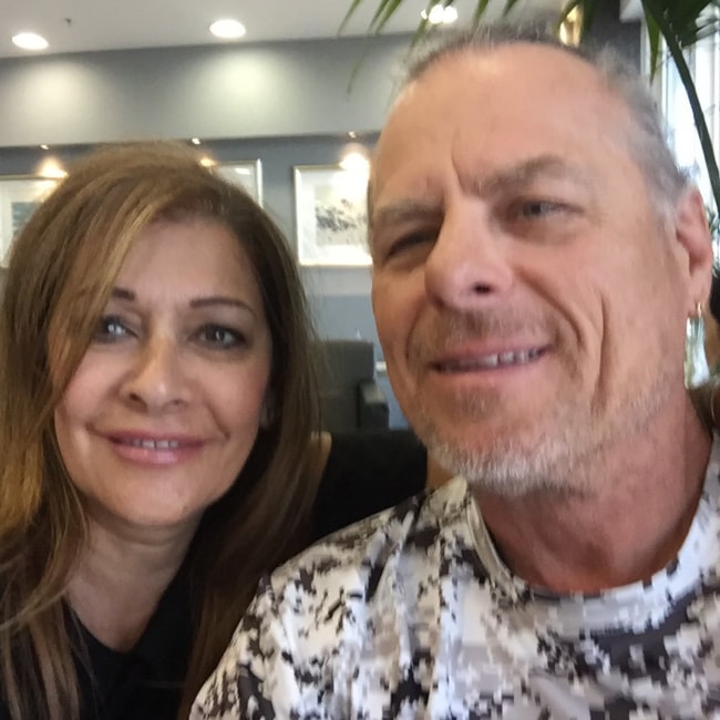 Marina Sirtis as seen in a picture wuth her husband Michael Lamper at the Athens airport in August 2018