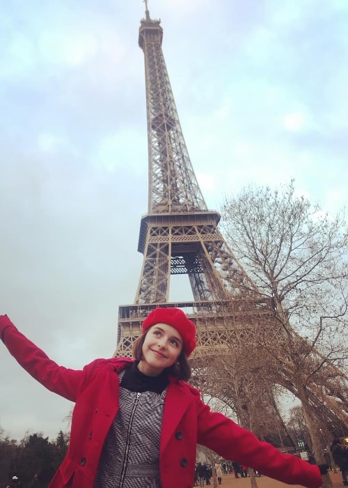 Mckenna Grace as seen while posing for a picture with the backdrop of Eiffel Tower in Paris, France in December 2018