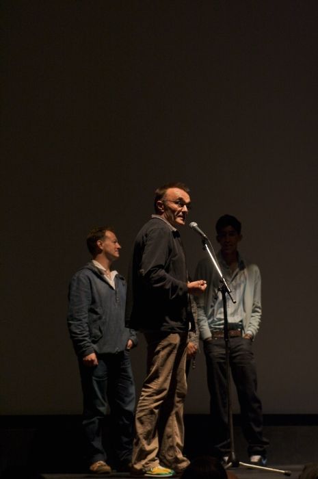 Danny Boyle seen with Simon Beaufoy and Dev Patel at the screening of Slumdog Millionaire during the Toronto Film Festival in 2008