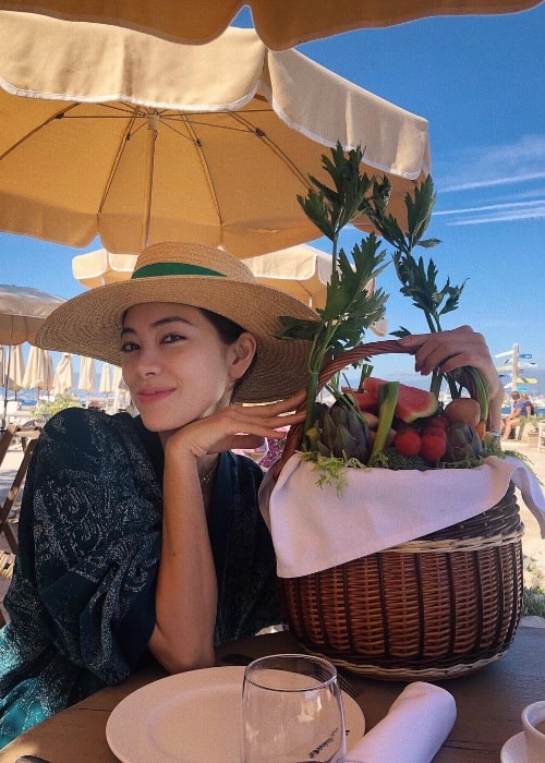 Hikari Mori as seen while posing for the camera with her basket of fruits in Provence-Alpes-Cote d'Azur, France in September 2018