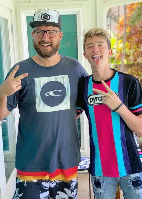 Jason Coffee as seen while posing for a picture alongside Maverick Baker while enjoying a vacation in Hawaiʻi, United States in July 2019