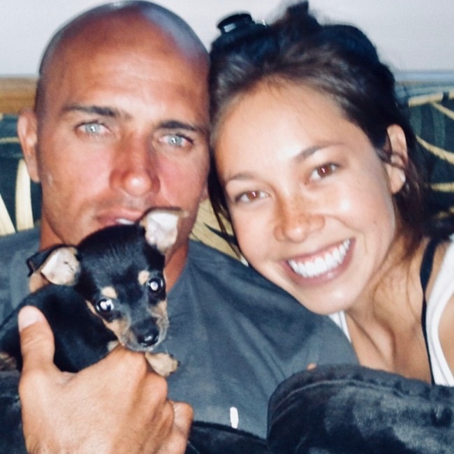 Kelly Slater with his girlfriend Kalani with their puppy as seen in July 2018