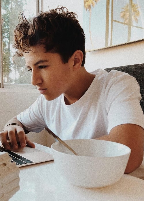 Mason Coutinho as seen in a picture while focusing on his laptop in January 2019