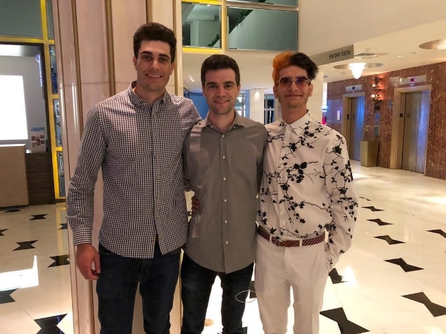 Noah Grossman as seen while posing for the camera along with his older brothers, Matthew (Center) and Justin (Left), at the bachelor party for Matthew at Miami Beach, Florida, United States in August 2018