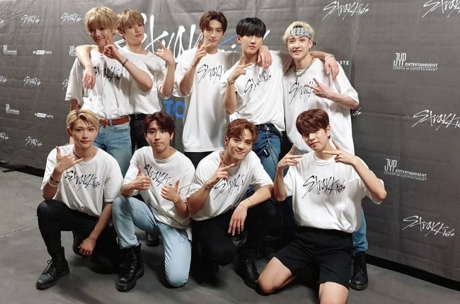 'Stray Kids' members as seen while posing for a group picture in August 2019