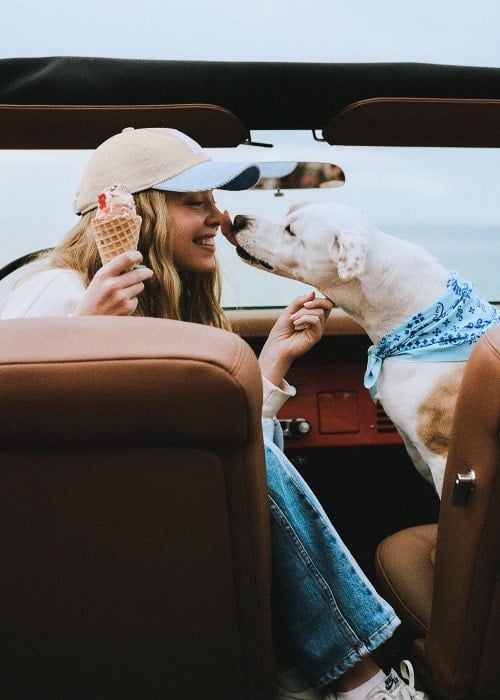 Sydney Sweeney in a March 2023 picture spending time with Ford Cars and her dog