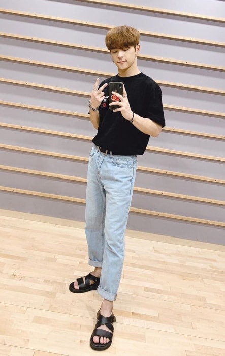 Woojin as seen while taking a Sunday mirror selfie in July 2019