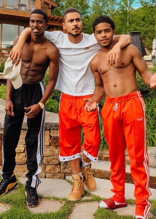 Christian Casey Combs as seen while posing for the camera along with Quincy (Center) and Justin Dior Combs (Right) in July 2019