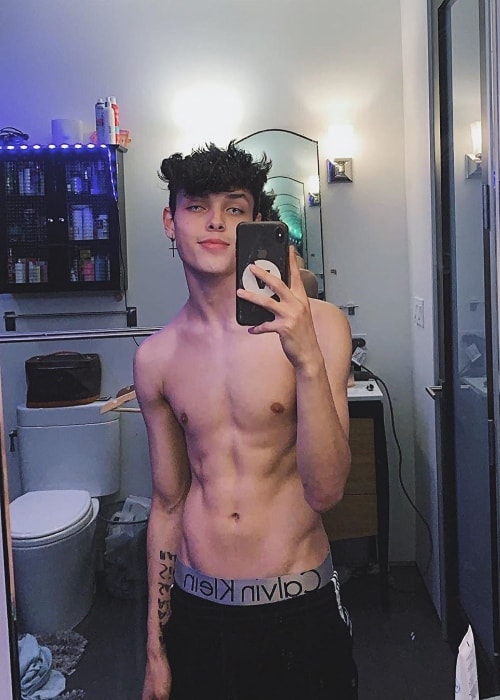 Christopher Romero as seen while taking a shirtless mirror selfie in Los Angeles, California, United States in September 2019