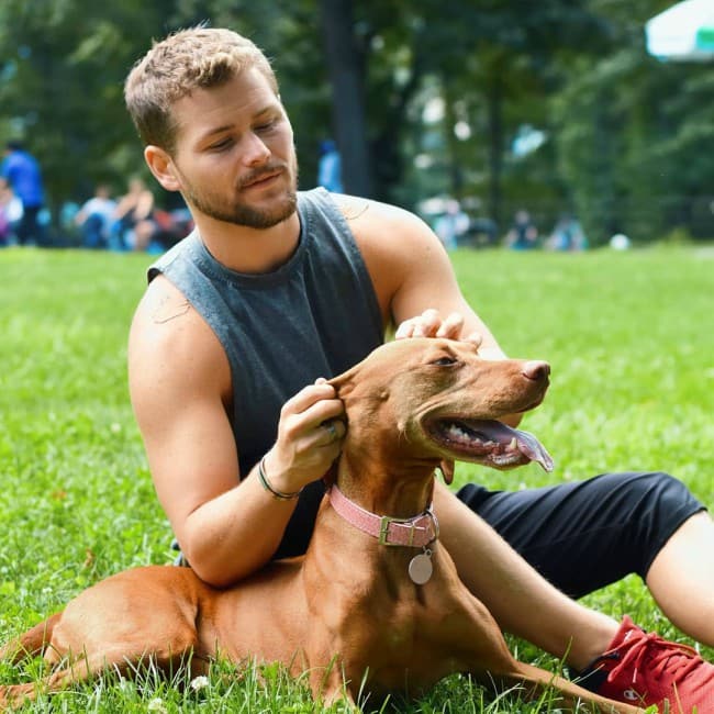 Drew Lynch with his dog as seen in September 2019