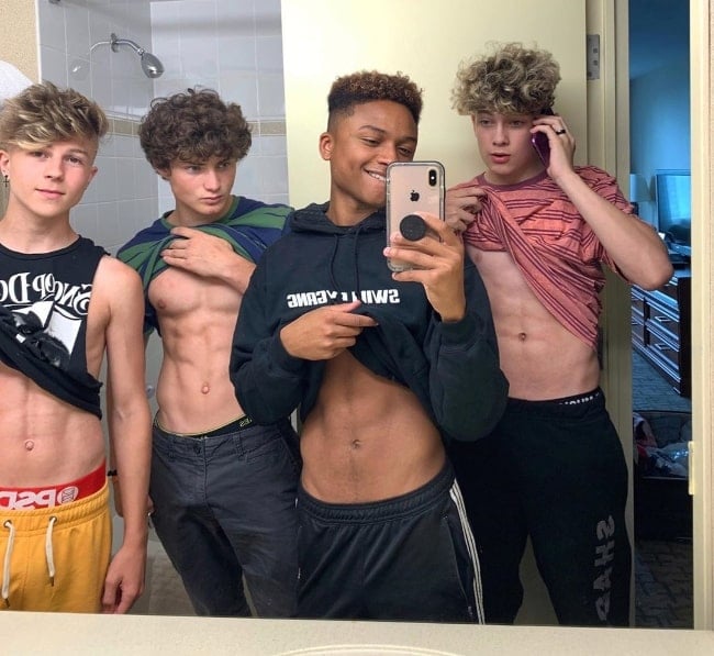 From Left to Right - Dylan Hartman, Rex Michael Campbell, Andre Swilley, and Luca Schaefer-Charlton as seen while posing for a mirror selfie flaunting their toned core in July 2019