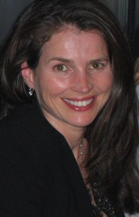 Julia Ormond as seen while smiling for the camera in September 2005