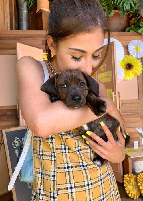 Megan DeAngelis with her dog Disco as seen in April 2019