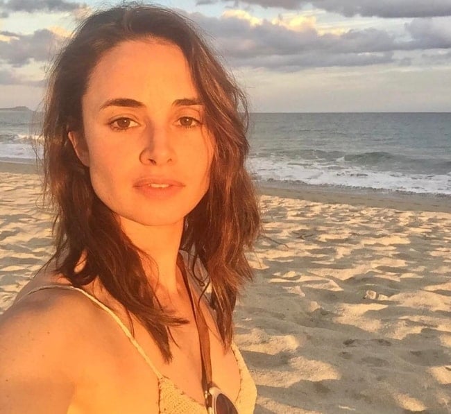 Mía Maestro as seen while taking a sun-kissed selfie standing by a beach in Malibu, Los Angeles County, California, United States in April 2017