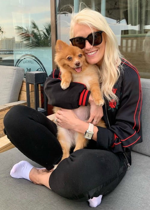 Supercar Blondie with her dog as seen in July 2019