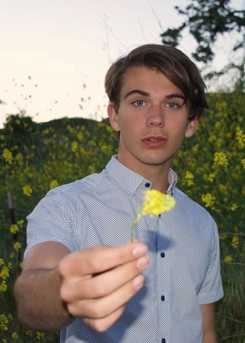 Alex Whitehouse as seen while posing for a picture while holding a flower in Calabasas, Los Angeles County, California, United States in April 2019
