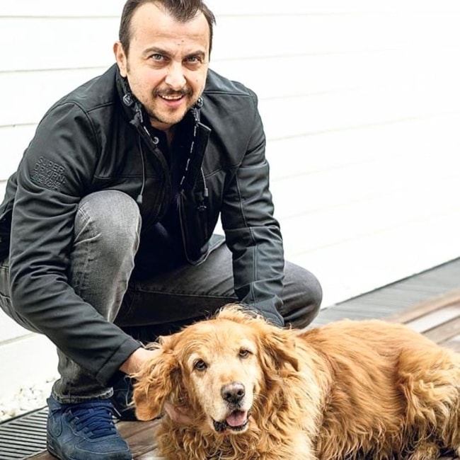 Ali Atay as seen while posing alongside an adorable dog in July 2019