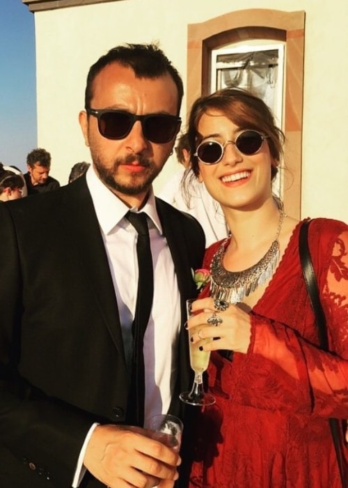 Ali Atay as seen while posing for a picture alongside Hazal Kaya during an event in August 2019