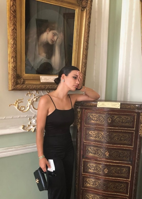 Beste Kökdemir as seen while posing like the girl in the portrait behind her in September 2019