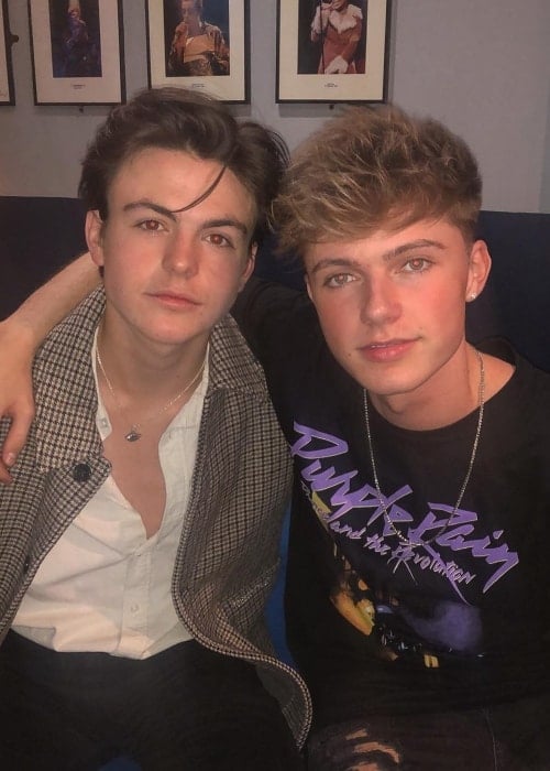 Blake Richardson (Left) as seen while posing for a picture along with singer, dancer, and television presenter, Hrvy, in October 2018
