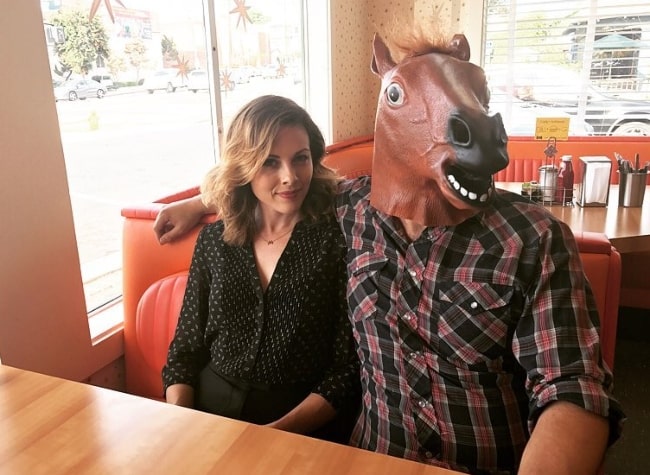 Julie Mond as seen in a picture alongside Mike Postalakis, wearing a fake horse head, in Cindy's Eagle Rock Restaurant in July 2017